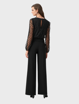 Black wide leg jumpsuit, featuring a relaxed fit and elegant silhouette.