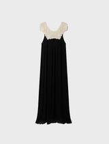 Elegant long dress in black and white viscose georgette, featuring a delicate ecru lace bib and a soft, lightweight silhouette.