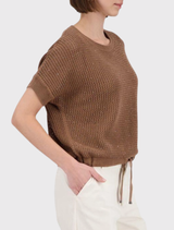 Monari pullover in brown, featuring a round neck, short sleeves, open-knit design, rhinestones on the front, and adjustable hem.
