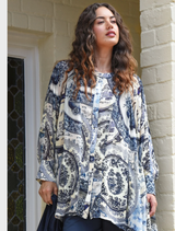 Blue Plate shirt with swing-shaped bodice, flared panels, and button-through front, crafted in viscose georgette for elegance.