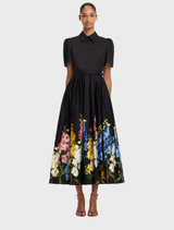 A short sleeve midi dress featuring a snapdragon print in ebony colors, showcasing a stylish and elegant design.