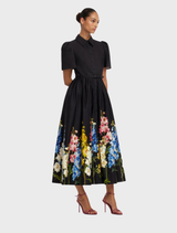 Elegant Bianca midi dress with short sleeves, showcasing a striking snapdragon print in ebony tones. Perfect for any event.