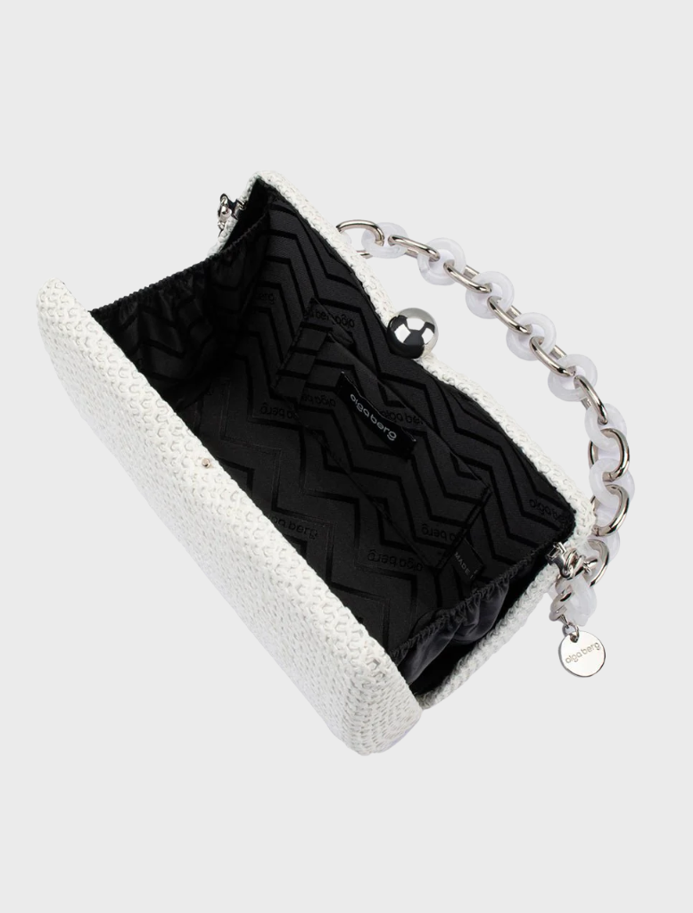White clutch bag featuring a chain strap and textured handle, combining elegance and functionality for any fashion-forward individual.