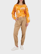 Biscotti-colored structured pant, designed with a sleek silhouette and tailored details for a polished appearance.