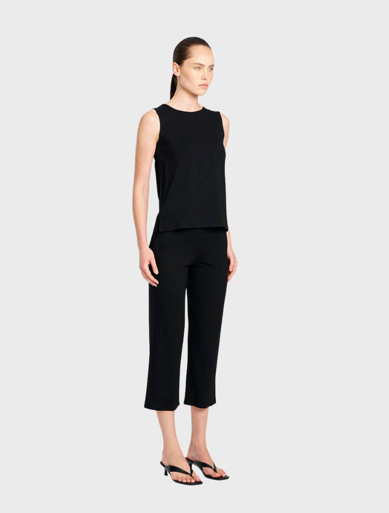 Black 3/4 length pants presented, showcasing a simple design that pairs well with a variety of tops for a stylish look.