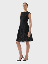 Black Alexandria dress laid flat, highlighting its smooth fabric and tailored fit for a chic look.