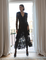 Black Antoinette dress with a classic design, showcasing a fitted bodice and a graceful, flowing skirt.