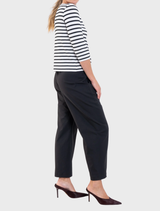 Black Barrel Leg Pant made from Gravitene fabric, featuring a flat-front waistband, elastic back, and side pockets for comfort.