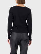 Black jewelry item marked "M," featuring a minimalist style that complements a range of outfits and accessories.