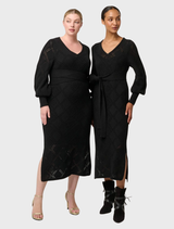 Elegant black V-neck knit dress crafted from a soft viscose cotton blend, perfect for casual or semi-formal occasions.