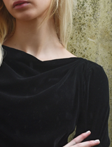 Chic black Soft Spell Top made from soft material, suitable for both casual and dressy occasions.