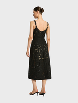 Black Colette dress showcasing a sleek design with refined accents, ideal for evening events or special gatherings.