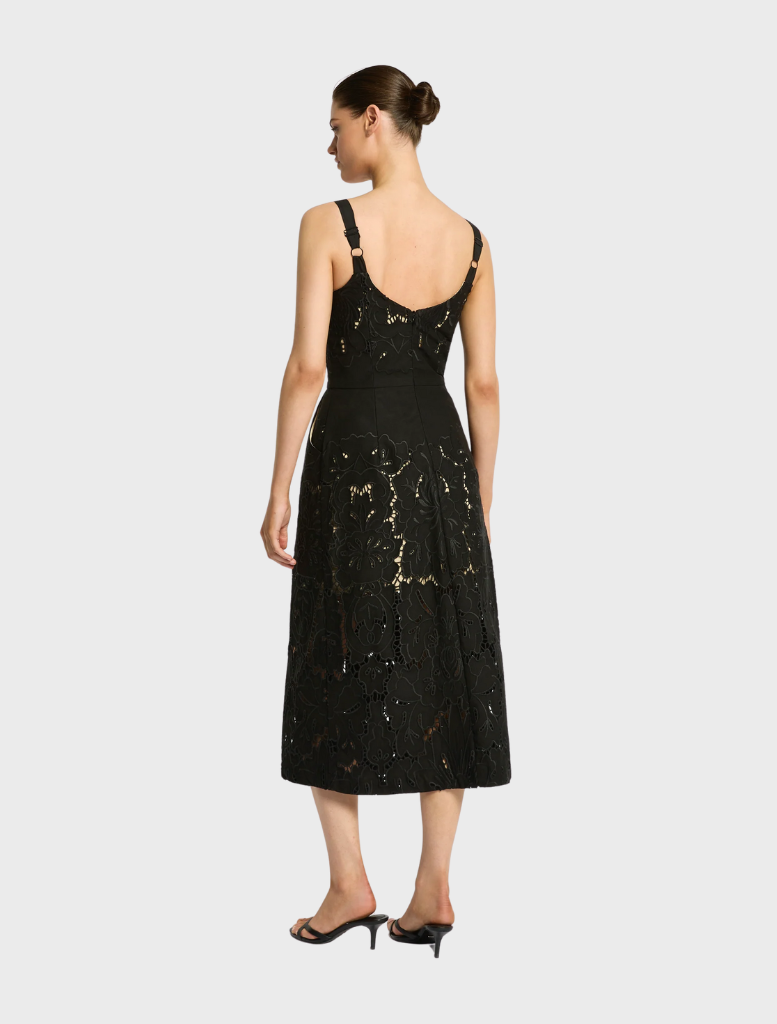 Black Colette dress showcasing a sleek design with refined accents, ideal for evening events or special gatherings.