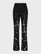 A pair of black Colette Pants laid flat, highlighting the tailored fit and smooth fabric.