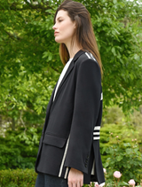 Black Cooper Club Jacket shown on a mannequin, showcasing its contemporary style and tailored silhouette.
