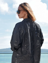 Black Drift Away shirt showcasing delicate sequins and embroidery, crafted in a linen blend for a stylish, relaxed fit.