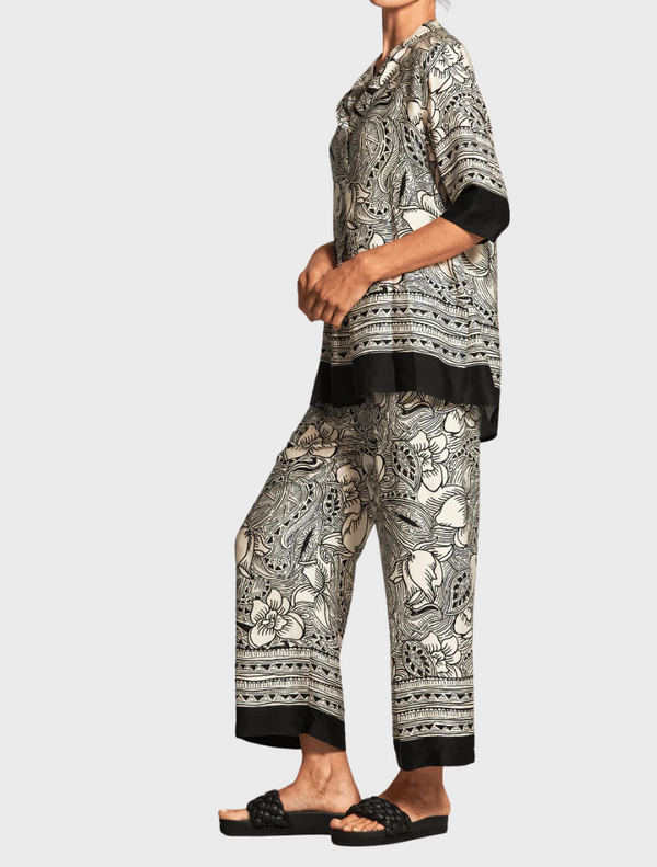 A stylish top adorned with an elephant print, highlighting unique textures and patterns in a monochromatic color scheme.