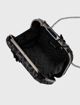 Stylish black clutch with sequins, removable shoulder chain, and clasp closure, designed to hold a large smartphone comfortably.