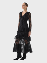 Chic black Antoinette dress, highlighting a sleek silhouette and a soft, flowing skirt ideal for elegant gatherings.