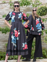 Elegant black dress adorned with a floral weasel pattern, suitable for various events.