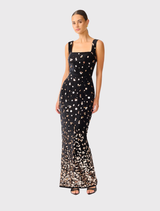 Luxurious black velvet gown adorned with gold accents, featuring a square neckline, adjustable straps, and a fitted silhouette.