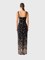 Elegant black velvet gown with gold detailing, square neckline, and sleeveless design, perfect for formal events.

