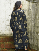 Black and gold Loom With A View dress with a chic design, offering a sophisticated look for evening wear.
