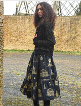 Elegant black skirt with gold accents, showcasing a unique design that combines style and sophistication for various occasions.