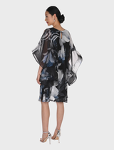 Elegant black and grey woven dress by Frank Lyman, showcasing lightweight chiffon, A-line design, and chic cape sleeves.