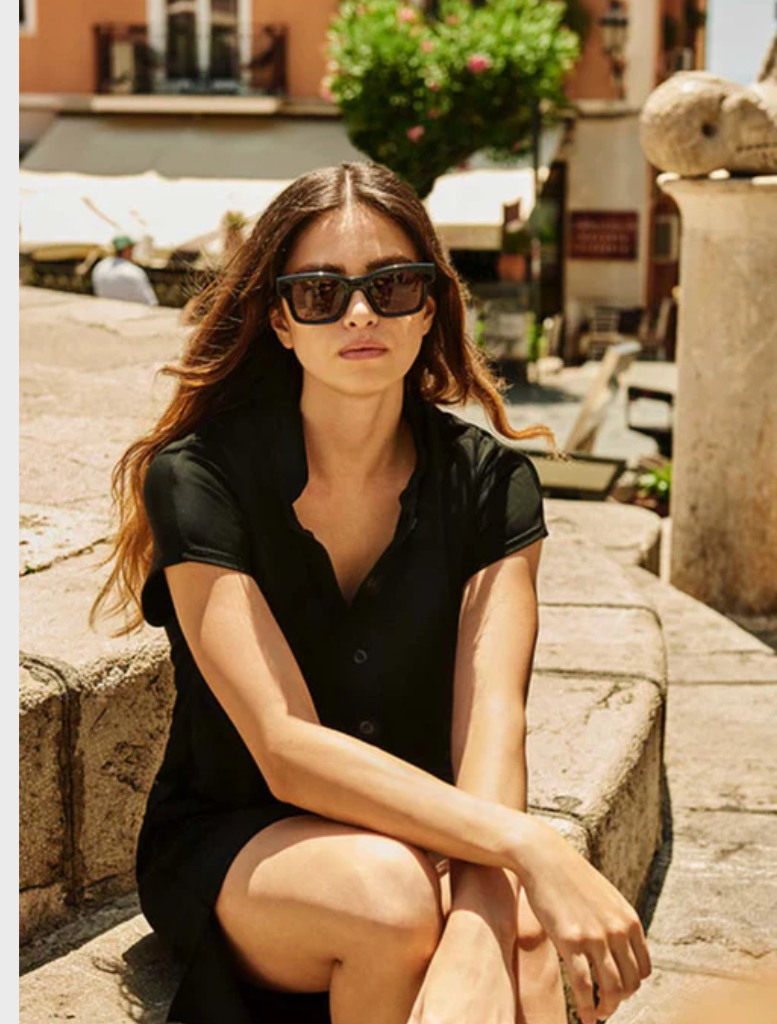 Short-sleeved black dress, showcasing a simple and elegant design.