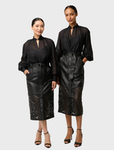 Custom laser-cut black leather midi skirt featuring a striking lattice pattern, perfect for a chic and modern outfit.