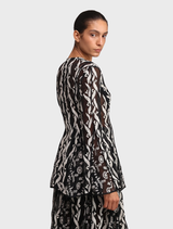 Elegant black Lianne top with a modern cut, suitable for various styling options.