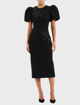 Stylish black midi dress featuring a tailored silhouette and a knee-length hem, ideal for sophisticated outings.