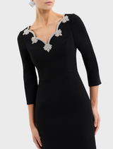 Stylish black long-sleeve midi dress, offering a chic and versatile option for any wardrobe, ideal for multiple occasions.