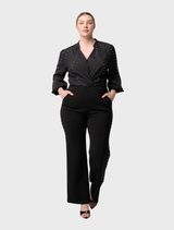 Elegant black stretch pants by Marcela Pearl, adorned with embellishments for a chic appearance.