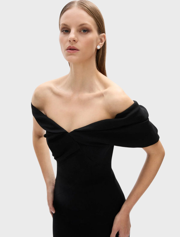 Black Mattie dress featuring a sleek design, short sleeves, and a flattering fit, ideal for special events.