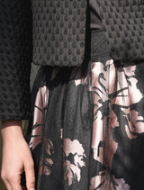 Stylish black and pink skirt adorned with a bow, ideal for casual or semi-formal events.