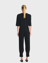 Black Plaza Crew Top on a mannequin, emphasizing its casual and versatile style.