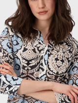 Women's dress with a black print, embellished with blue and white paisley motifs, perfect for beach outings.