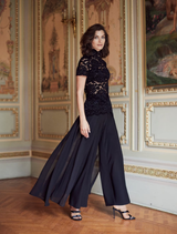 Black floral lace pullover featuring intricate lace patterns and a stylish, comfortable fit for casual wear.