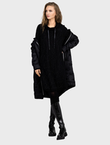 Elegant black quilted coat, designed for warmth, featuring a high collar and a button front closure.