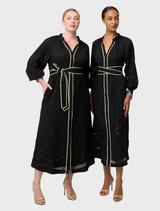 Elegant black maxi dress made of Tencel, adorned with delicate embroidery for a stylish look.