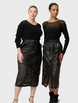 Elegant black sheer knit top crafted from viscose and nylon, perfect for layering or wearing alone for a stylish look.