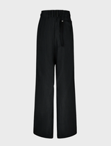 Black trousers with a rusty effect, blending contemporary style with a retro vibe.