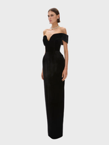 Stylish black Ryn gown draped elegantly, highlighting its modern cut and luxurious material.