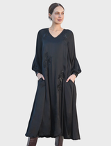 Black evening dress with sparkling details, tailored for a sleek fit, perfect for special occasions and nighttime events.