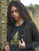 Shine Of The Times cardigan in black and gold, highlighting a chic design with a shimmering finish.