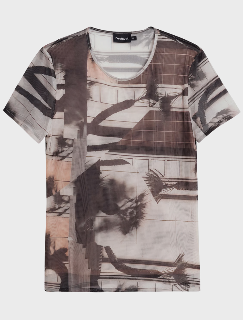 A shirt featuring a colorful pattern, highlighting her unique style and fashion choice.