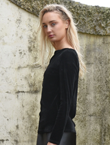 Elegant black Soft Spell Top with a soft texture, perfect for versatile styling in any wardrobe.