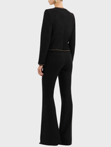 Black Stargazing Jacket featured on a hanger, emphasizing its contemporary design and color.